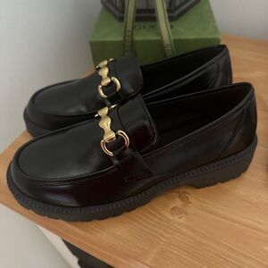 Women’s Black Leather Loafers with Gold Accent